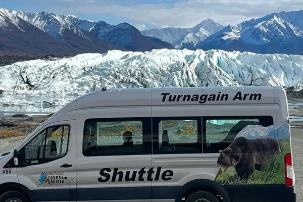 Tour shuttle van parked below the Matanuska Glacier