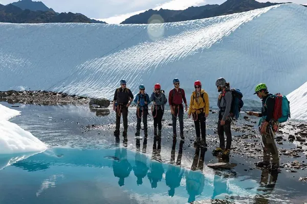 Guided group beside a meltwater pool on the Matanuska Glacier